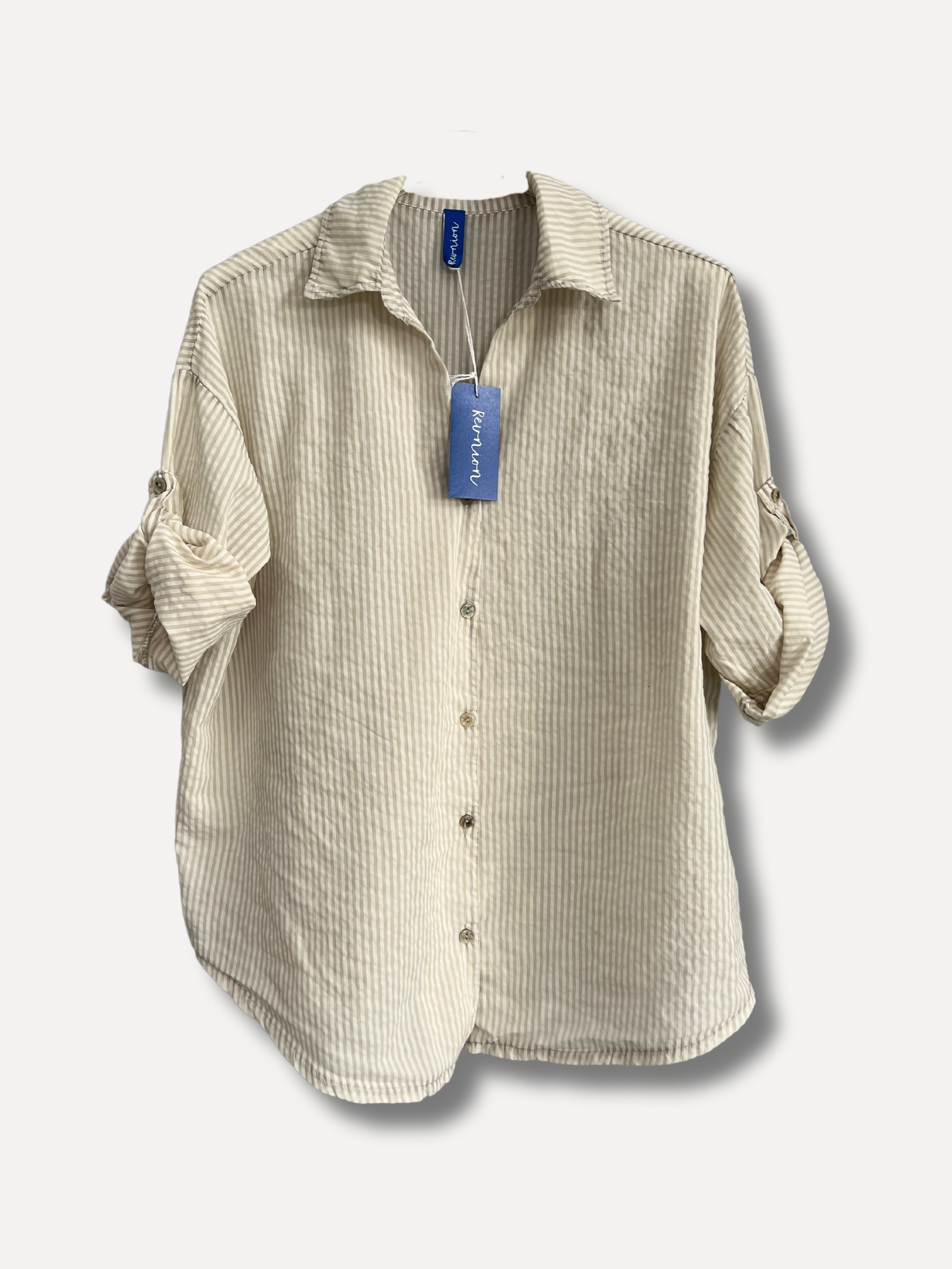 A striped shirt in beige and white with roll tabs.